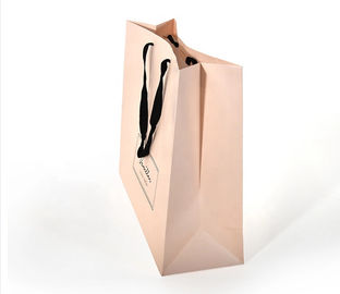 O punho liso do algodão projeta sacos de papel, cor cor-de-rosa impressa dos sacos de compras de papel fornecedor