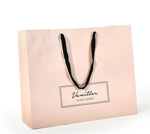O punho liso do algodão projeta sacos de papel, cor cor-de-rosa impressa dos sacos de compras de papel fornecedor